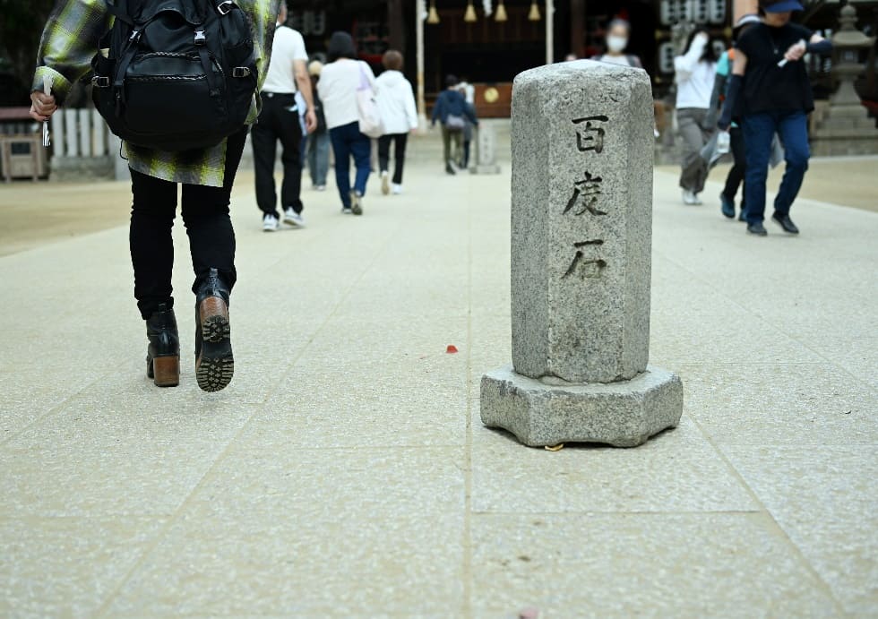 Worshippers circle two small stone pillars 100 times in prayer, a meaningful ritual believed to bring healing.