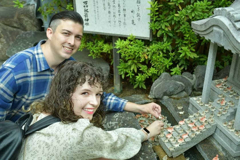 We prepared to place our turtles at the designated shrine, joining hundreds of others filled with heartfelt wishes.