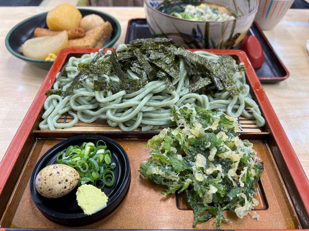 The food was beautifully presented on a square dish, with vibrant colours and fresh ingredients. A quail egg, wasabi, and spring onions nestled on the side on a small container of dashi broth, ready for mixing and dipping.