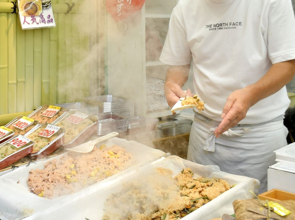 The two different rices – one called okowa, a savoury flavoured sticky rice, and the other a lighter red bean rice traditionally enjoyed during celebrations.